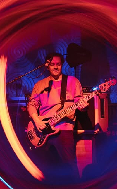 The band eggy playing the guitar